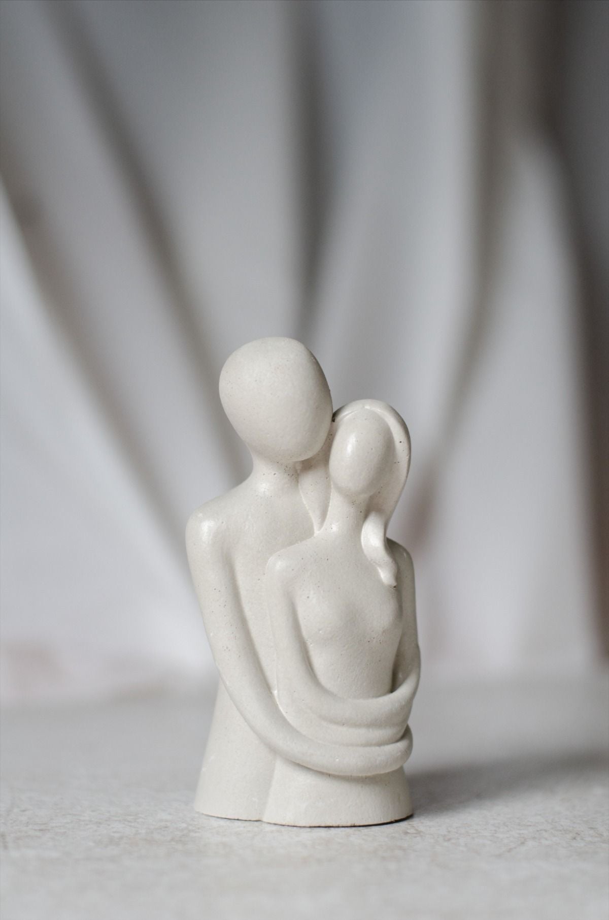 Embracing Couple Cement Figurine